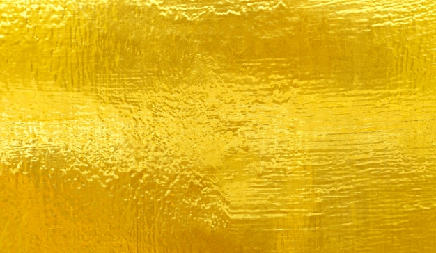 Gold polierter Metallstahl Textur abstrakten Hintergrund.