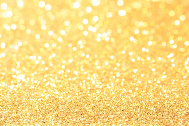 Gold- und weiße Bokeh-Lichter defokussiert. abstrakter Hintergrund