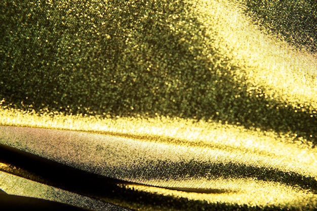 Gold wellig. Luxusstoff oder flüssige Welle oder gewellte Falten der Schmutzseidenbeschaffenheit