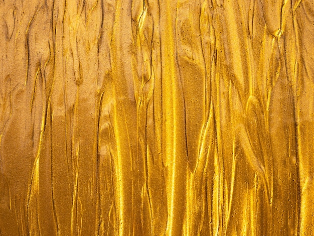 Goldene Farbtextur mit leuchtend gelben Reflexen