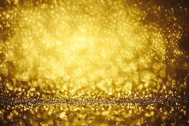 Goldene glitzernde Bokeh-Lichtstruktur Verschwommener abstrakter Hintergrund für Geburtstag, Jahrestag, Hochzeit, Silvester oder Weihnachten