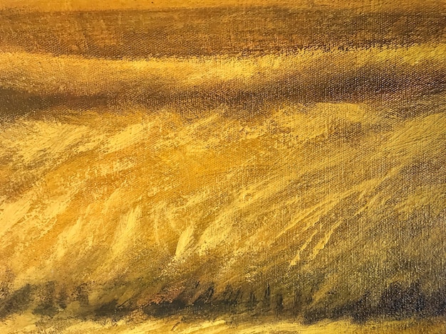 Goldene und braune Farben des abstrakten Kunsthintergrundes. Aquarell auf Leinwand mit gelbem Farbverlauf.