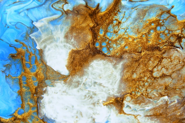 Goldene und dunkelblaue gemischte Acrylfarben Marmorstruktur Flüssige Kunst