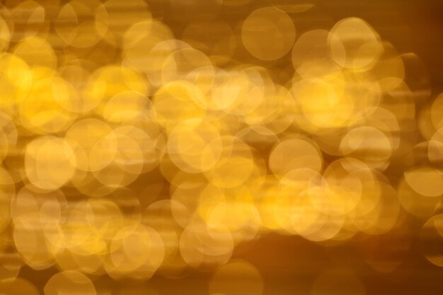 Goldener Hintergrund mit abstrakten Bokeh-Lichtern