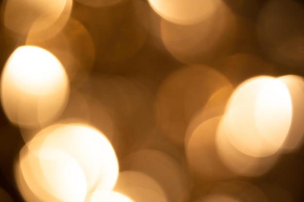 Goldener Sepia-Bokeh-Hintergrund Abstrakte Bokeh-Lichter für den Hintergrund oder die Überlagerung