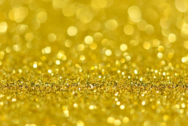 Goldglitter mit Boden und perspektivischer Bokehwand.