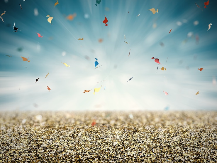 Foto goldglitterboden mit konfetti auf blauem hintergrund