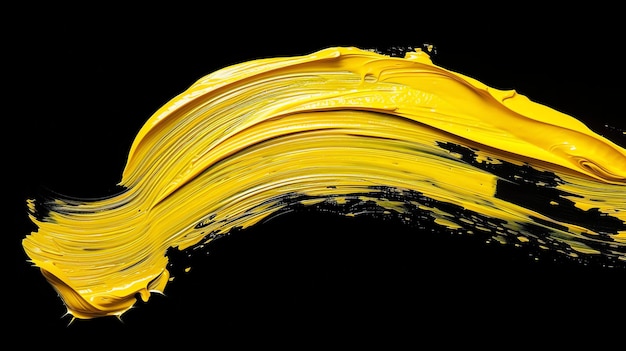 Foto golpe de pincel de pintura al óleo amarillo aislado sobre fondo negro