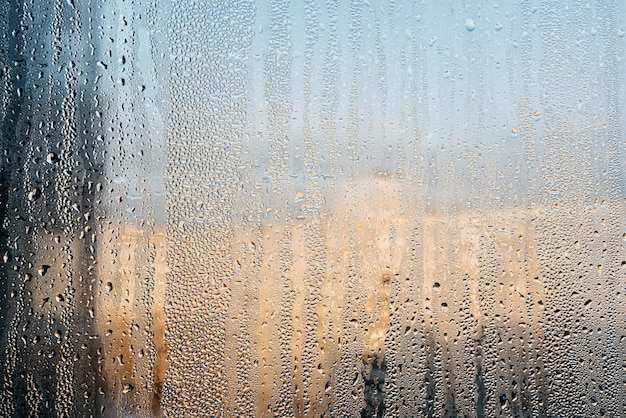 Gotas de agua sobre el fondo de textura de patrón abstracto de vidrio de ventana Foto de alta calidad