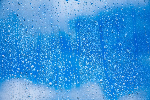 Gotas de agua de textura abstracta sobre vidrio