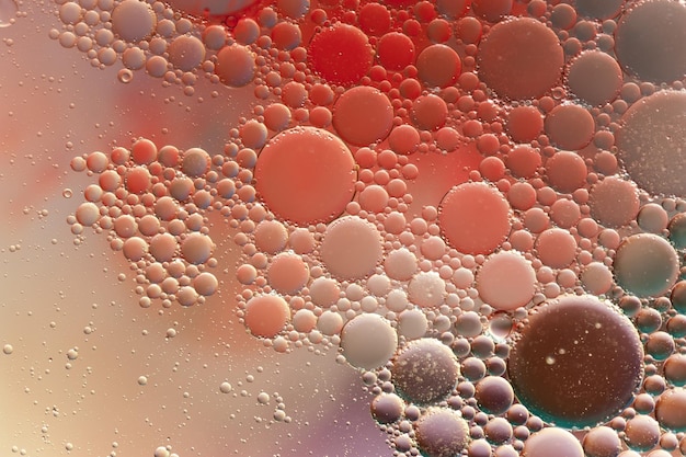 Gotas y burbujas de tinta de aceite de colores. Fondo de textura mixta de plantilla de diseño de pintura abstracta. Telón de fondo de color decorativo líquido. Patrón de papel tapiz.