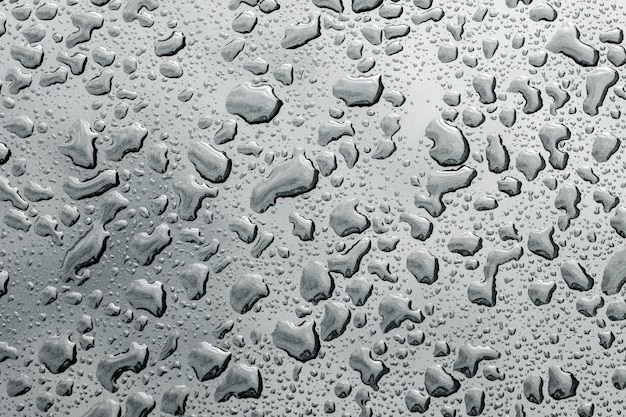 Gotas de água na superfície. foto abstrata como pano de fundo.