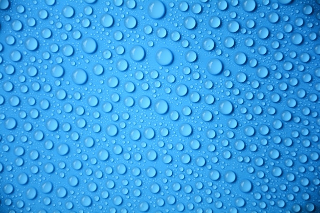 Gotas de água no fundo azul textura