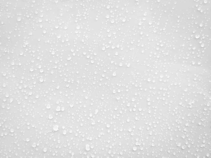 Gotas de água no fundo branco da superfície.