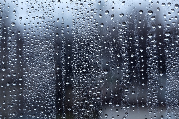 Gotas de chuva na janela água bokeh blur fundo