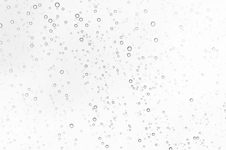 Foto gotas de chuva no fundo de vidro