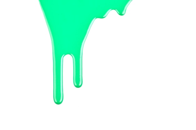 Gotas de tinta fluindo em papel branco Borrões de tinta verde abstraem o fundo