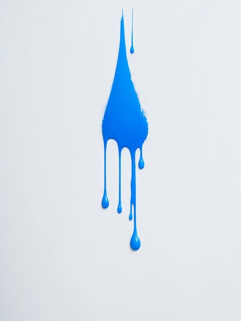 Foto las gotas de pintura azul en la pared blanca