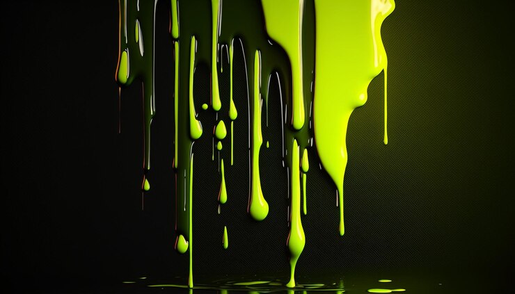 Goteo de pintura verde sobre un fondo negro