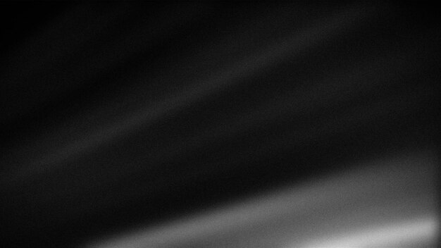 Gradiente abstracto oscuro en tonos negros y grises con una sutil textura granulada ideal para fondos atmosféricos de mal humor y proyectos de diseño minimalistas