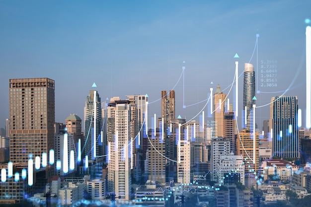 Gráfico de comportamiento del mercado holograma puesta de sol vista panorámica de la ciudad de Bangkok ubicación popular para lograr un título financiero en el sudeste asiático El concepto de análisis de datos financieros Doble exposición