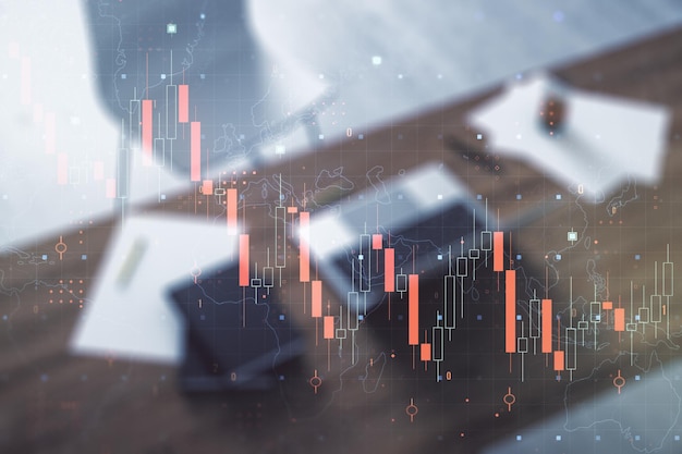 Gráfico de crisis económica abstracta creativa con holograma de mapa mundial y escritorio moderno con pc en bancarrota de fondo y concepto de recesión Multiexposición