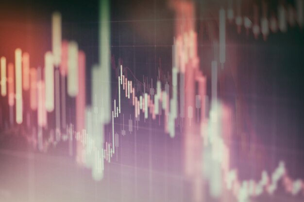 Gráfico económico con diagramas en el mercado de valores, para conceptos e informes comerciales y financieros. Fondo azul abstracto.