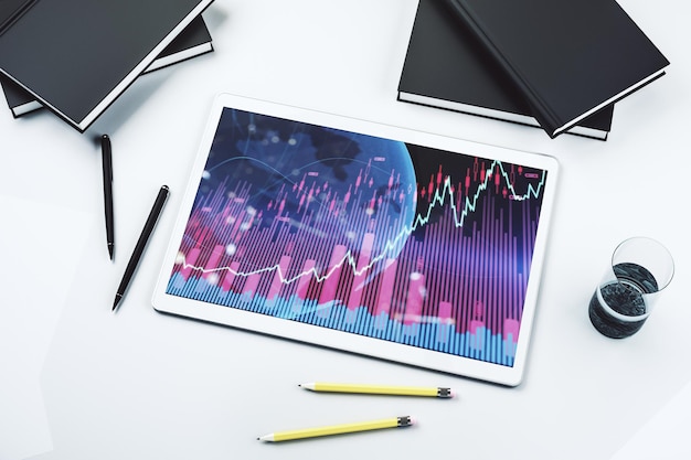 Gráfico financiero creativo abstracto con mapa mundial en la pantalla de la tableta digital moderna forex y concepto de inversión Vista superior Representación 3D