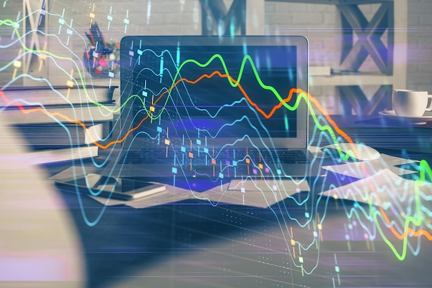 Gráfico financiero dibujo colorido y tabla con computadora en el fondo Doble exposición Concepto de mercados internacionales