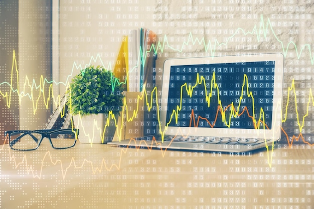 Gráfico financiero dibujo colorido y tabla con computadora en el fondo Doble exposición Concepto de mercados internacionales