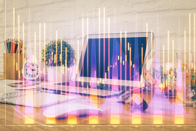 Gráfico financiero dibujo colorido y tabla con computadora en el fondo Doble exposición Concepto de mercados internacionales
