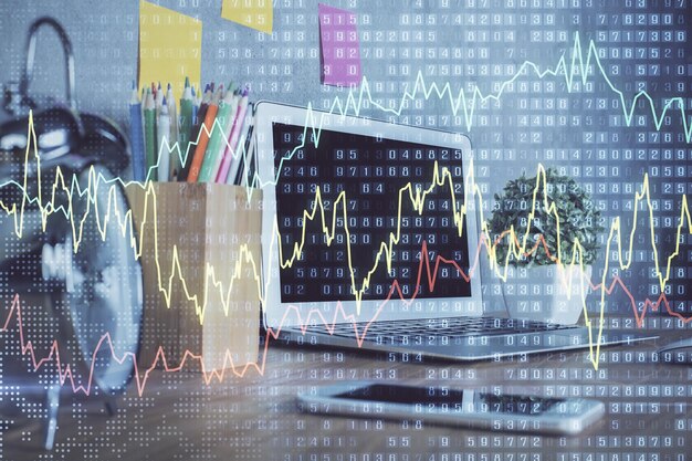 Gráfico financiero dibujo colorido y tabla con computadora en el fondo Doble exposición Concepto de mercados internacionales