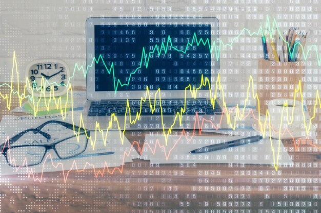 Gráfico financiero dibujo colorido y tabla con computadora en el fondo Doble exposición Concepto de mercados internacionales