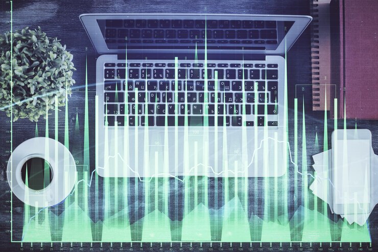 Foto gráfico del mercado de valores y computadora de vista superior en el fondo de la mesa doble exposición concepto de análisis financiero