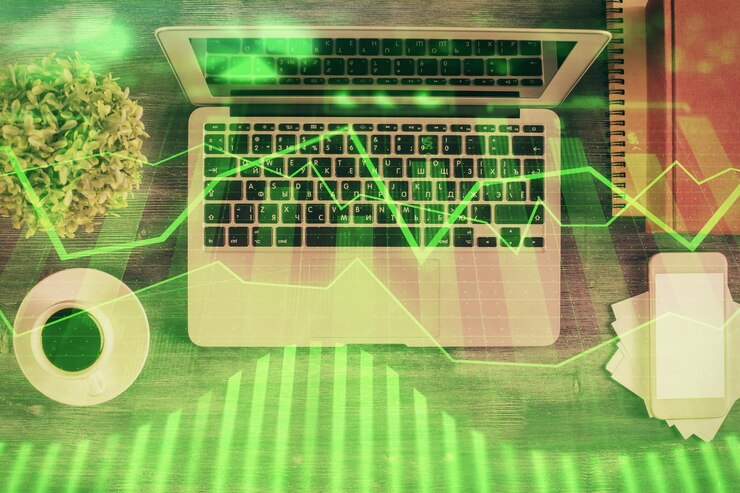 Foto gráfico del mercado de valores y computadora de vista superior en el fondo de la mesa doble exposición concepto de análisis financiero