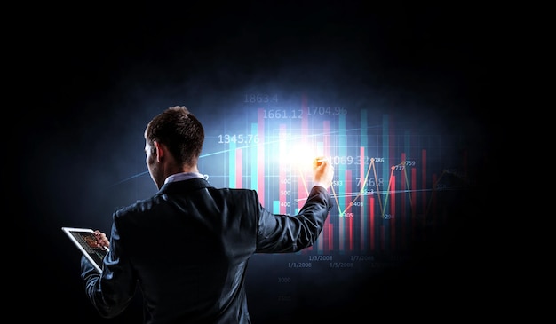 Gráfico de negocios y monitor de comercio. Técnica mixta