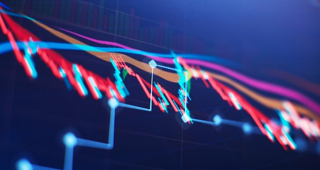 Gráfico de precio técnico e indicador gráfico de velas rojas y verdes en la pantalla de tema azul volatilidad del mercado tendencia alcista y bajista Fondo de moneda criptográfica de negociación de acciones