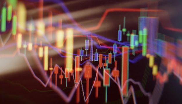 Gráfico de precios e indicador gráfico de velas rojas y verdes en la pantalla de tema azul volatilidad del mercado tendencia al alza y a la baja Fondo de moneda criptográfica de comercio de acciones