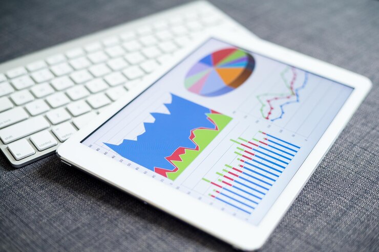 Foto gráficos y diagramas de negocios en tableta digital