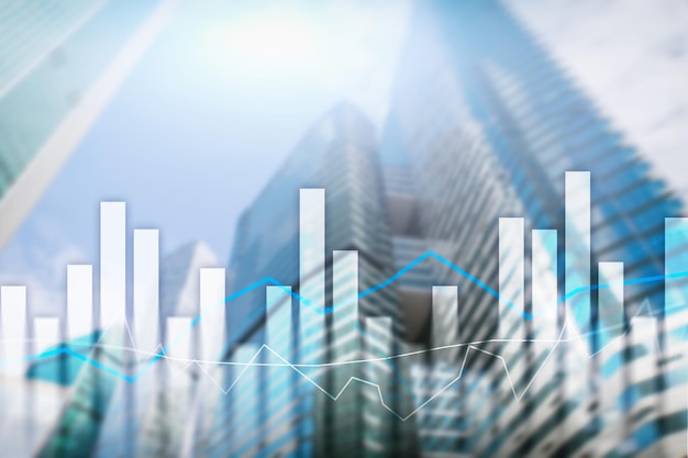 Gráficos financieros y tablas sobre el fondo borroso del centro de negocios Concepto de inversión y comercio