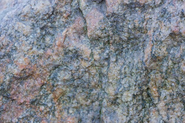 Granit-Textur aus der Nähe Granitgesteine mit poröser Oberfläche Hintergrund aus massivem Stein