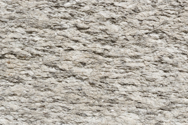 Granit- und Zementsteinmauer als Bauelement und natürliche Oberfläche