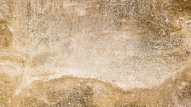 Granitsteinbeschaffenheit. Brown-goldener Steinhintergrund. Alte leere Steinwandoberfläche oder alter schmutziger brauner Papiertexturhintergrund braun oder beige. brauner Goldgrunge.