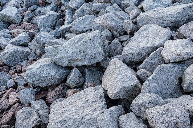 Granitsteinbruch. Textur aus Granitstein, Felsbrocken verstreut.