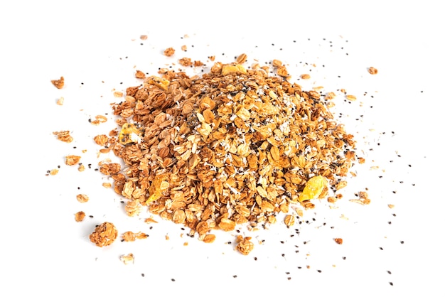 Granola aus ganzen Haferflocken mit Kokoschips, Ananas und Chiasamen isoliert auf weißem Hintergrund. Müsli isoliert. Ein schnelles Frühstück. Gesundes Frühstück. Foto in hoher Qualität