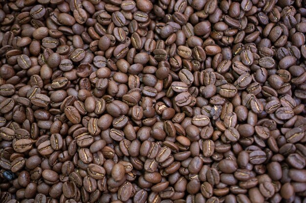 Granos de café listos para el fondo de la amoladora