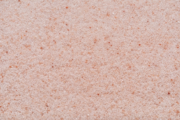Gránulos de sal rosa del Himalaya de cerca la textura o el fondo macro shot