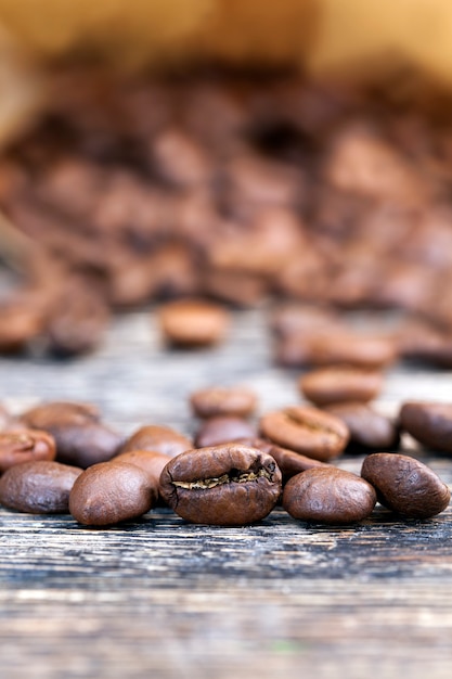 Foto grãos de café aromáticos crus ou torrados, grãos de café para a produção de deliciosos cafés