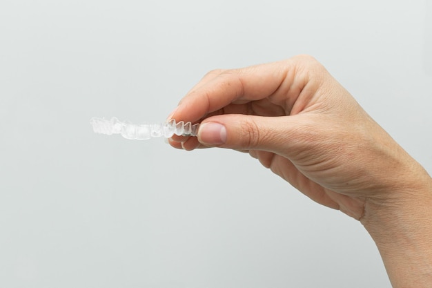 Foto grapas invisibles alisadores de dientes transparentes pinzas de plástico transparente