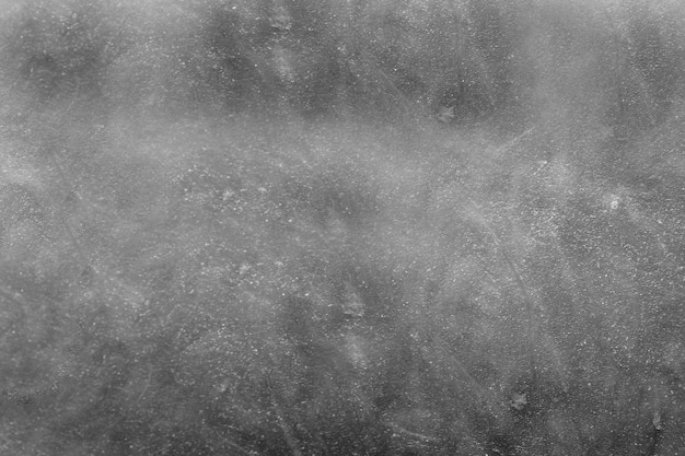 Graue Textur mit kleinen Schäden